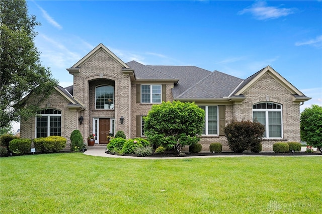 4738 Saddletop Ridge Ln, Mason, OH 45040 - view of front facade featuring brick siding, a front lawn, and a shingled roof