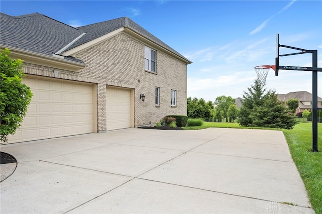 4738 Saddletop Ridge Ln, Mason, OH 45040 - view of side of property featuring concrete driveway, brick siding, and roof with shingles