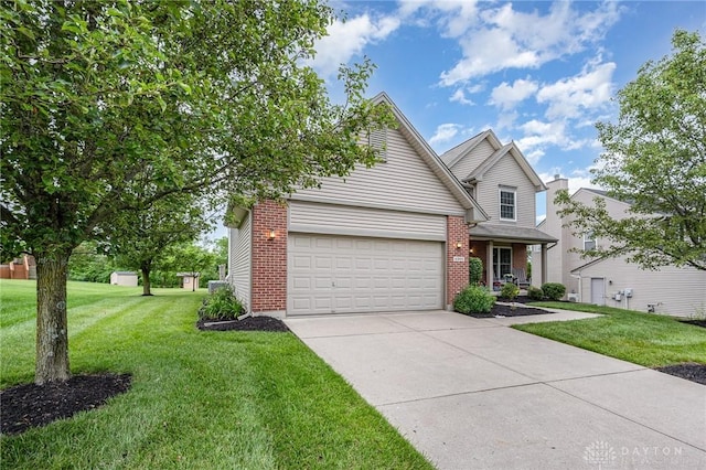 4395 Turtledove Way, Miamisburg, OH 45342 - traditional-style home featuring concrete driveway, a front yard, and brick siding