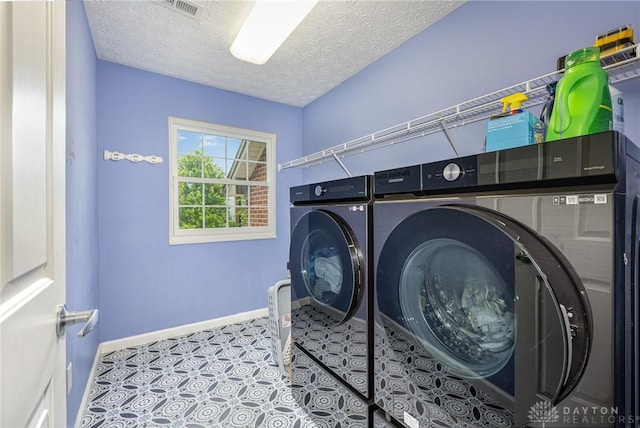 4395 Turtledove Way, Miamisburg, OH 45342 - laundry room with washing machine and dryer and a textured ceiling