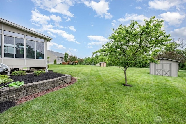 4395 Turtledove Way, Miamisburg, OH 45342 - view of green lawn with a storage shed and a sunroom