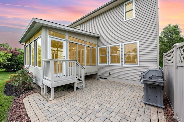 4395 Turtledove Way, Miamisburg, OH 45342 - back of property at dusk with a sunroom and a patio area