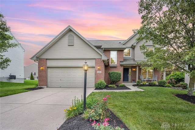 4395 Turtledove Way, Miamisburg, OH 45342 - traditional-style home featuring concrete driveway, brick siding, and a lawn
