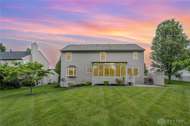 4395 Turtledove Way, Miamisburg, OH 45342 - rear view of house featuring a sunroom and a yard