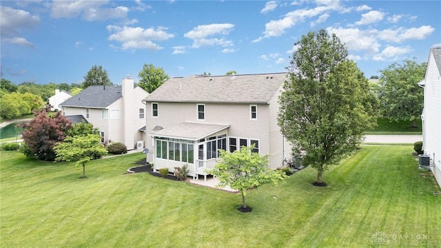 4395 Turtledove Way, Miamisburg, OH 45342 - back of house with a sunroom, a lawn, and roof with shingles