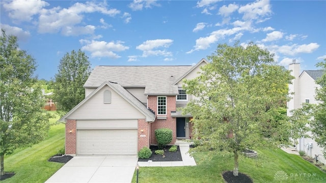4395 Turtledove Way, Miamisburg, OH 45342 - traditional-style house with brick siding, concrete driveway, a front lawn, an attached garage, and a shingled roof