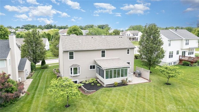 4395 Turtledove Way, Miamisburg, OH 45342 - back of property with a residential view, a sunroom, and roof with shingles