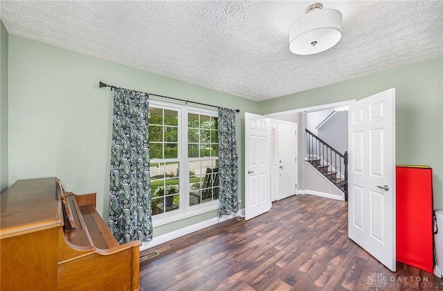 4395 Turtledove Way, Miamisburg, OH 45342 - unfurnished room with wood finished floors, a textured ceiling, and stairway