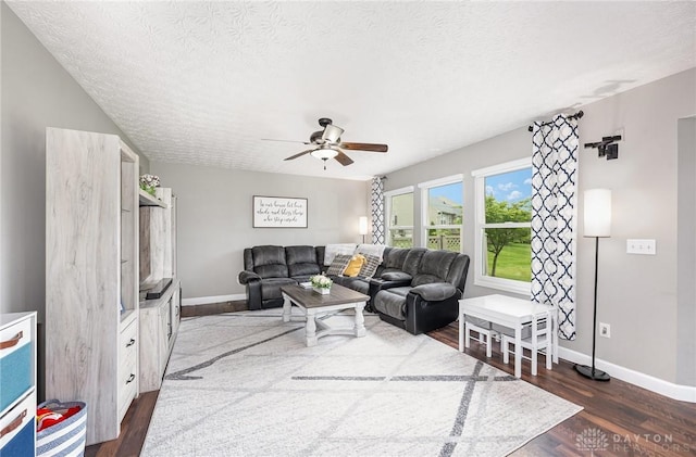 4395 Turtledove Way, Miamisburg, OH 45342 - living area featuring dark wood finished floors, a ceiling fan, and a textured ceiling