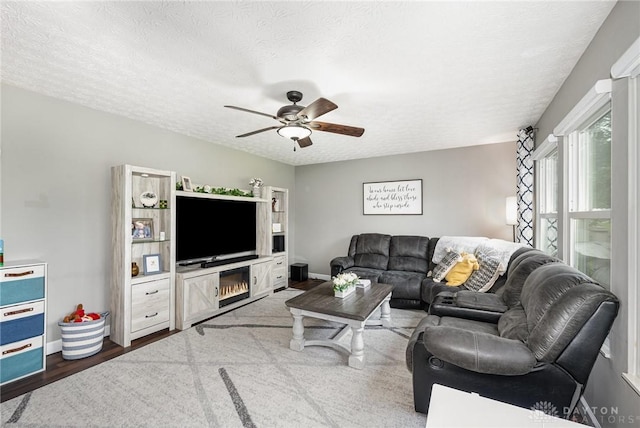 4395 Turtledove Way, Miamisburg, OH 45342 - living room with a ceiling fan, a textured ceiling, and dark wood finished floors
