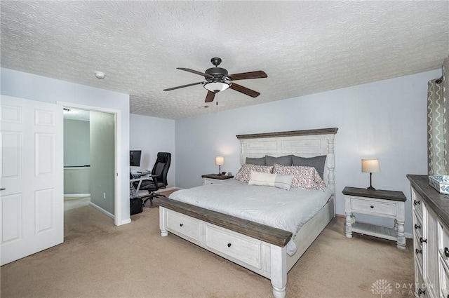 4395 Turtledove Way, Miamisburg, OH 45342 - bedroom featuring light carpet, a desk, ceiling fan, and a textured ceiling