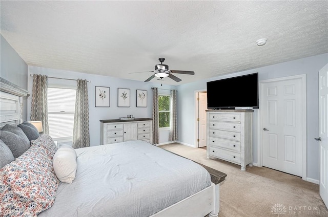 4395 Turtledove Way, Miamisburg, OH 45342 - bedroom with light colored carpet, a ceiling fan, and a textured ceiling