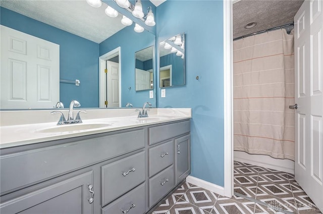 4395 Turtledove Way, Miamisburg, OH 45342 - bathroom with double vanity, a textured ceiling, and tile patterned flooring