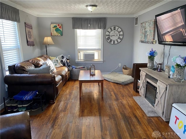 125 E Market St, Springboro, OH 45066 - living area featuring healthy amount of natural light, dark wood-style floors, ornamental molding, and cooling unit