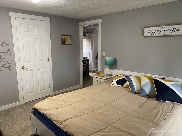 125 E Market St, Springboro, OH 45066 - carpeted bedroom with a textured ceiling and baseboards