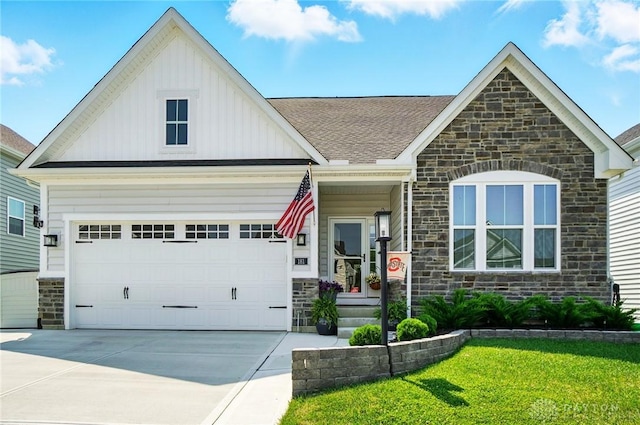 181 Cresting Rd, Fairborn, OH 45324 - view of front facade with stone siding, board and batten siding, concrete driveway, and a front lawn
