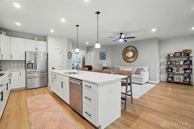 181 Cresting Rd, Fairborn, OH 45324 - kitchen with appliances with stainless steel finishes, open floor plan, ceiling fan, a center island with sink, and recessed lighting