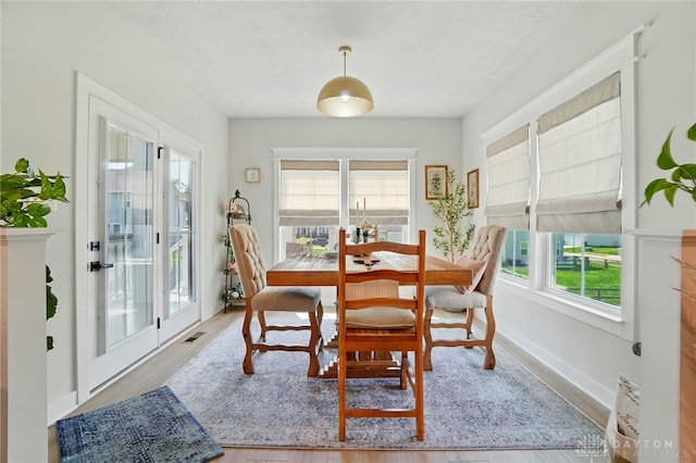 181 Cresting Rd, Fairborn, OH 45324 - dining space featuring plenty of natural light, wood finished floors, and a textured ceiling