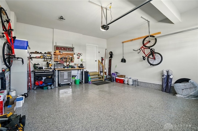 181 Cresting Rd, Fairborn, OH 45324 - garage featuring a workshop area and a garage door opener
