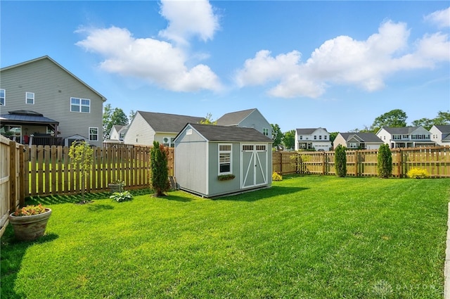 181 Cresting Rd, Fairborn, OH 45324 - fenced backyard with a residential view, a storage shed, and a gazebo
