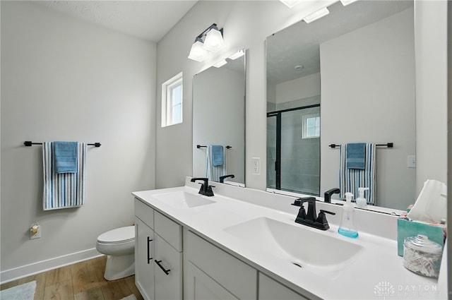 181 Cresting Rd, Fairborn, OH 45324 - full bath with wood finished floors, double vanity, and a shower with shower door