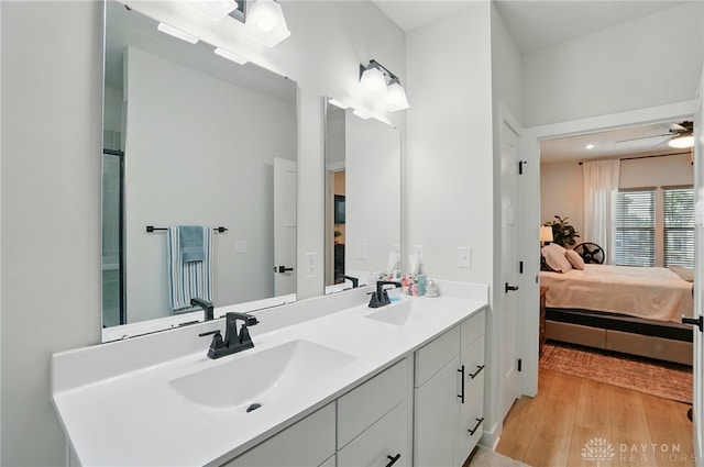 181 Cresting Rd, Fairborn, OH 45324 - ensuite bathroom with wood finished floors, double vanity, and ceiling fan