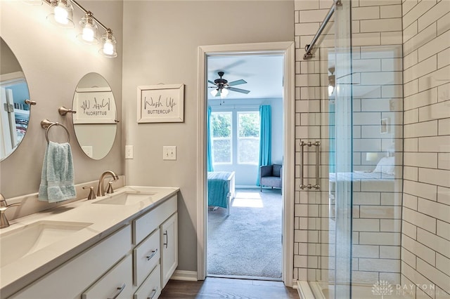 928 Southline Dr, Lebanon, OH 45036 - ensuite bathroom featuring double vanity, a shower stall, a ceiling fan, and wood finished floors
