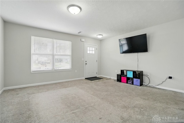 720 Diamond Loop, Middletown, OH 45044 - foyer featuring carpet floors and a textured ceiling