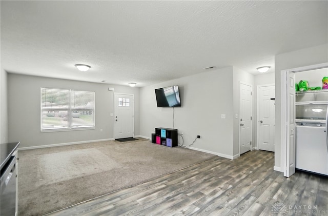 720 Diamond Loop, Middletown, OH 45044 - unfurnished living room featuring wood finished floors and a textured ceiling