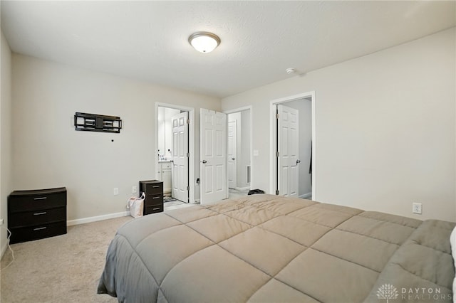 720 Diamond Loop, Middletown, OH 45044 - carpeted bedroom featuring baseboards and ensuite bath