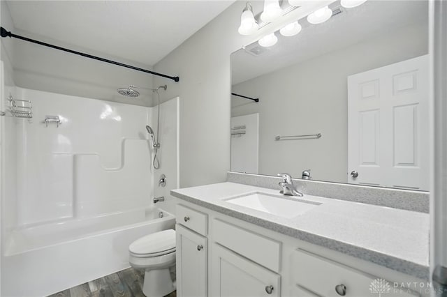 720 Diamond Loop, Middletown, OH 45044 - bathroom featuring vanity, bathing tub / shower combination, and wood finished floors