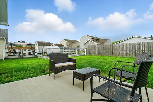 720 Diamond Loop, Middletown, OH 45044 - fenced backyard featuring a patio area, a residential view, a gazebo, and an outdoor hangout area