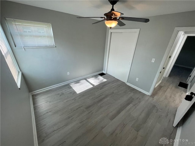 1601 Forrer Blvd, Kettering, OH 45420 - unfurnished bedroom featuring wood finished floors, ceiling fan, and a closet