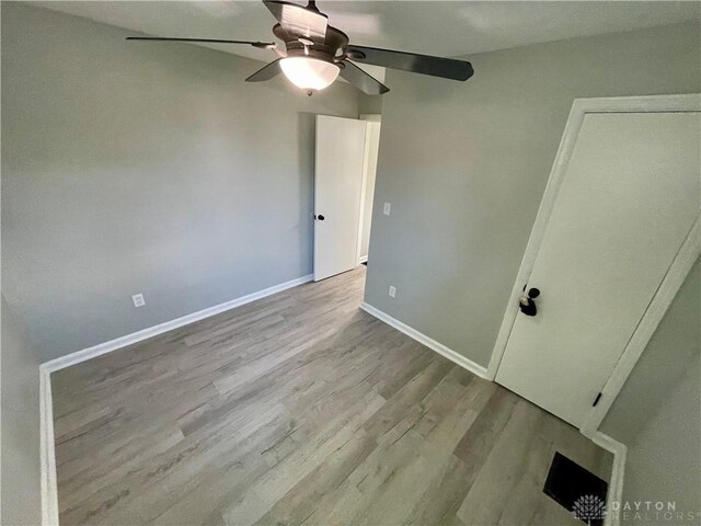 1601 Forrer Blvd, Kettering, OH 45420 - unfurnished bedroom with wood finished floors and ceiling fan