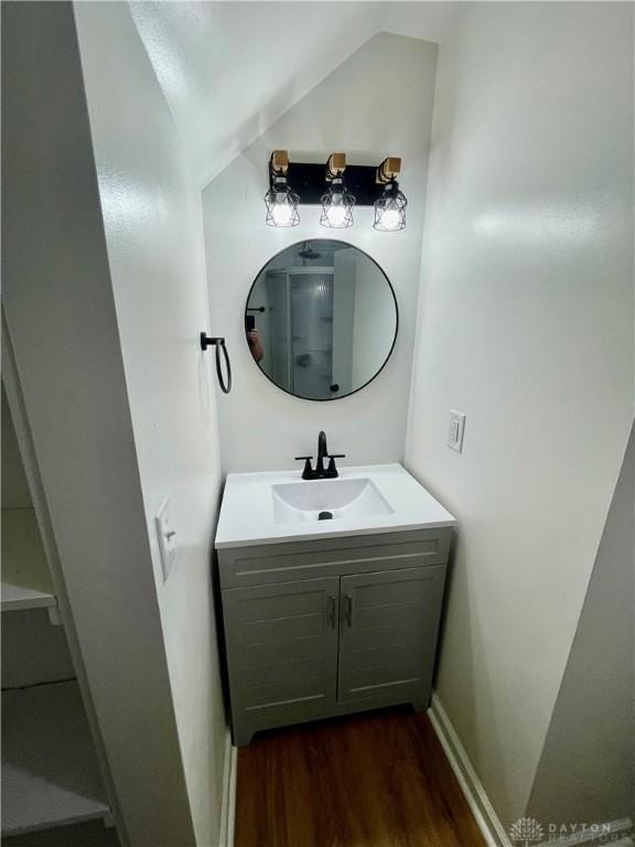 1601 Forrer Blvd, Kettering, OH 45420 - bathroom with vanity, wood finished floors, and lofted ceiling
