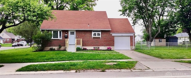 1601 Forrer Blvd, Kettering, OH 45420 - view of front of home with driveway, brick siding, and an attached garage