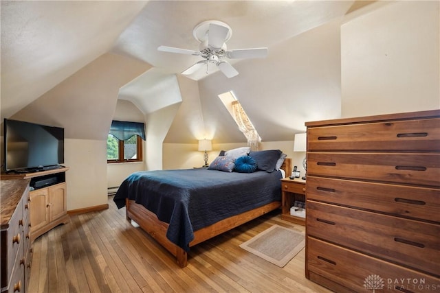 3611 Delaine Ave, Kettering, OH 45429 - bedroom featuring light wood-style floors, a baseboard heating unit, vaulted ceiling, and a ceiling fan