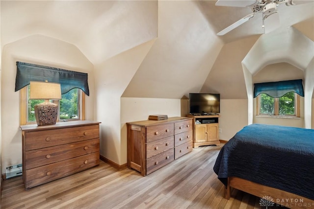 3611 Delaine Ave, Kettering, OH 45429 - bedroom featuring multiple windows, light wood-style floors, vaulted ceiling, and a ceiling fan