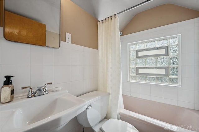 3611 Delaine Ave, Kettering, OH 45429 - full bath featuring shower / tub combo, tile walls, and vaulted ceiling
