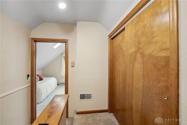 3611 Delaine Ave, Kettering, OH 45429 - bedroom featuring lofted ceiling, a closet, light colored carpet, and baseboard heating