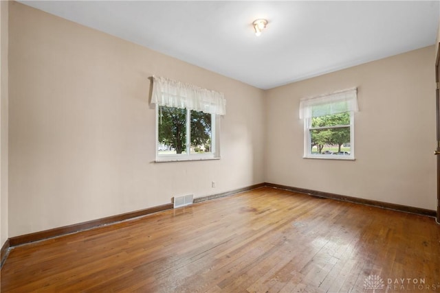 3611 Delaine Ave, Kettering, OH 45429 - empty room with hardwood / wood-style flooring and baseboards