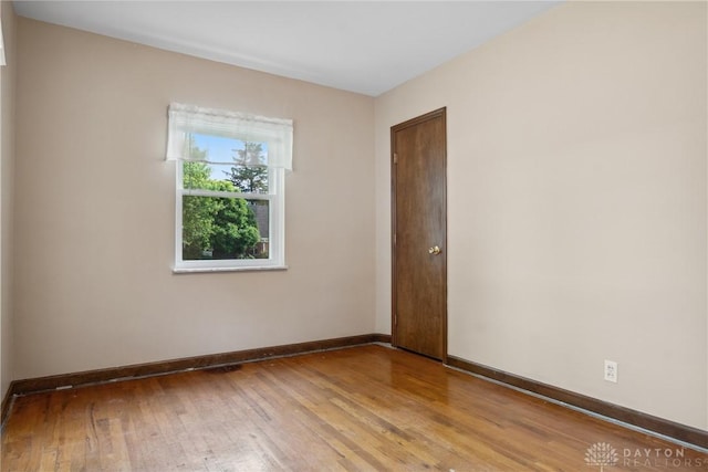 3611 Delaine Ave, Kettering, OH 45429 - unfurnished room featuring wood-type flooring and baseboards
