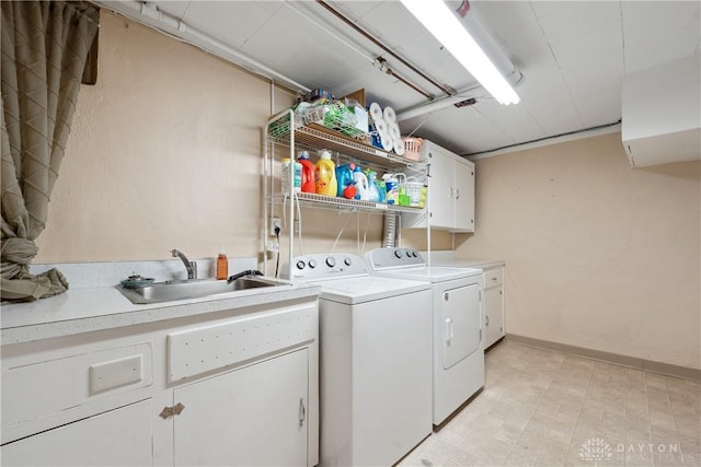 3611 Delaine Ave, Kettering, OH 45429 - laundry area featuring cabinet space and washing machine and clothes dryer