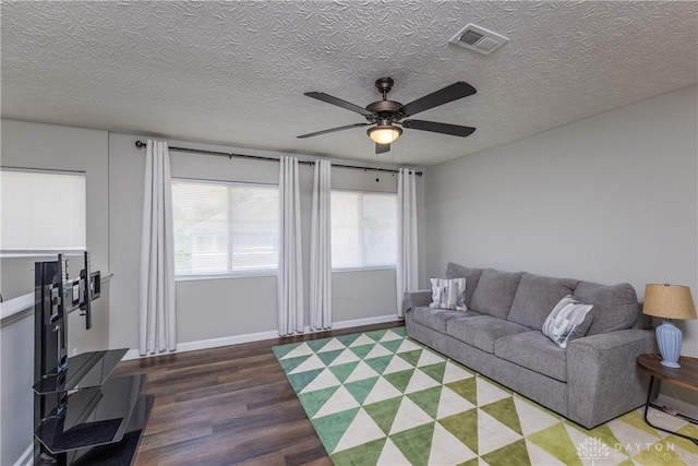1107 Sunset Dr, Englewood, OH 45322 - living room featuring wood finished floors, a textured ceiling, and a ceiling fan