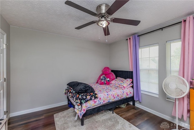 1107 Sunset Dr, Englewood, OH 45322 - bedroom with wood finished floors, a textured ceiling, and ceiling fan