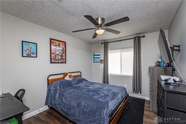 1107 Sunset Dr, Englewood, OH 45322 - bedroom with wood finished floors, a textured ceiling, and ceiling fan