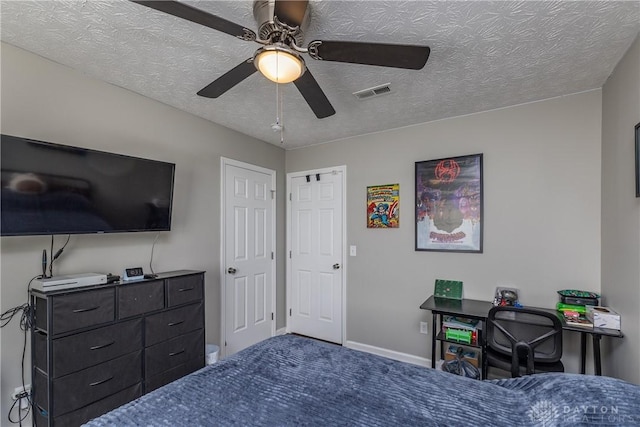 1107 Sunset Dr, Englewood, OH 45322 - carpeted bedroom featuring a textured ceiling and ceiling fan