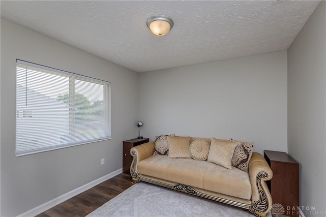 1107 Sunset Dr, Englewood, OH 45322 - living area with wood finished floors and a textured ceiling