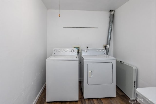 1107 Sunset Dr, Englewood, OH 45322 - laundry area featuring washing machine and dryer, dark wood-style flooring, and attic access