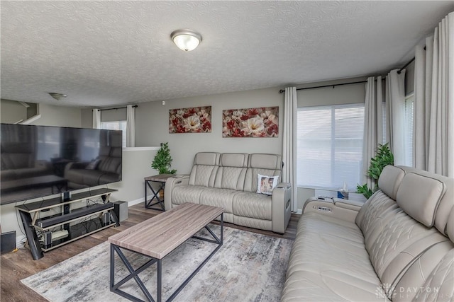 1107 Sunset Dr, Englewood, OH 45322 - living room with wood finished floors and a textured ceiling